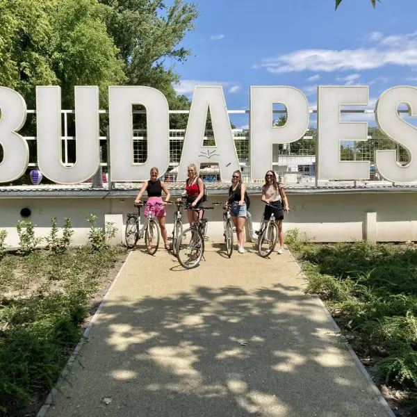 Happy group of four on bikes, in Budapest