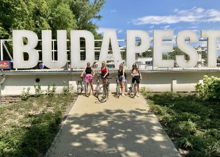 Happy group of four on bikes, in Budapest