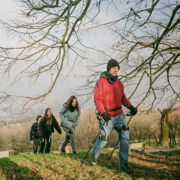 people walking uphill during an exoskeleton powered nature walk in the hills of Budapest