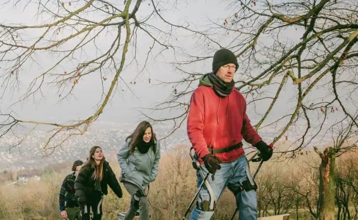 people walking uphill during an exoskeleton powered nature walk in the hills of Budapest