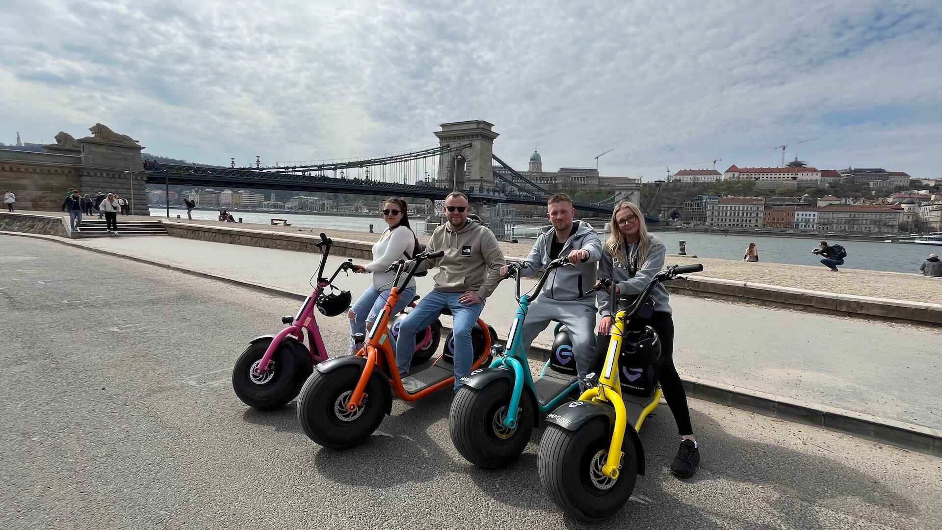 photo stop in front of the chain bridge during a guided escooter tour in Budapest